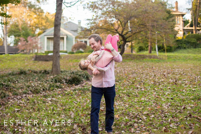 playful dad with his daughter in the park