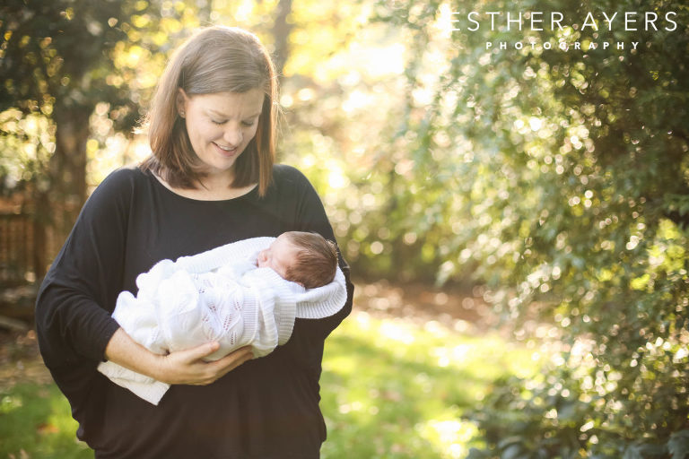 mom holding her newborn baby - esther ayers photography