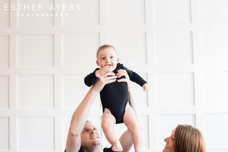 Six Month Old Boy lifted up in the air by Dad - Esther Ayers Photography