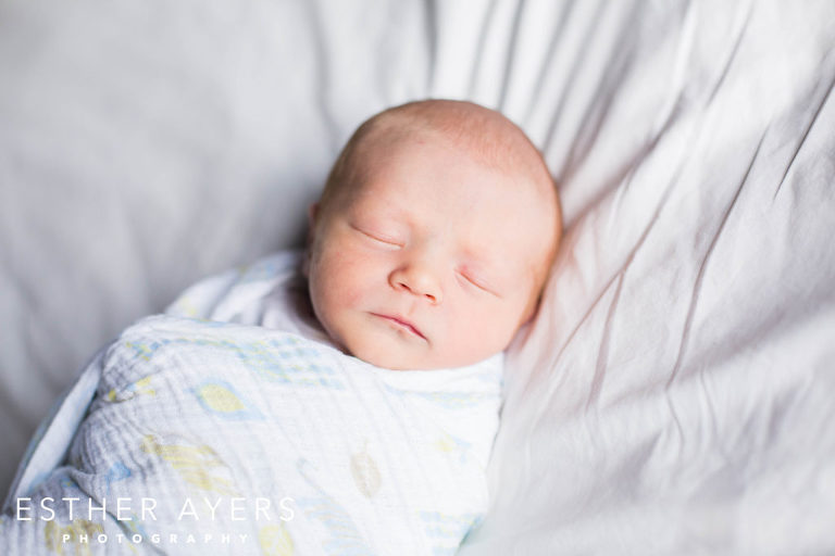 Newborn Baby Boy on bed closeup