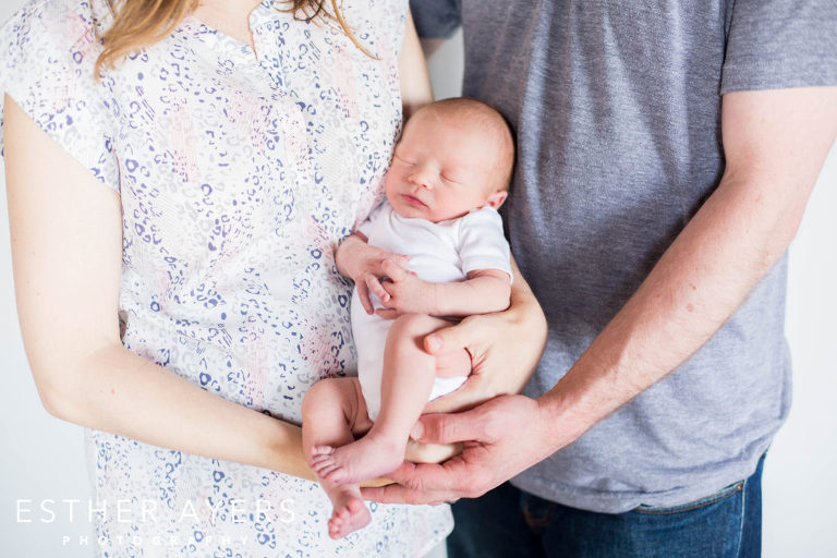 Newborn Baby Boy in Mom and Dad's Arms