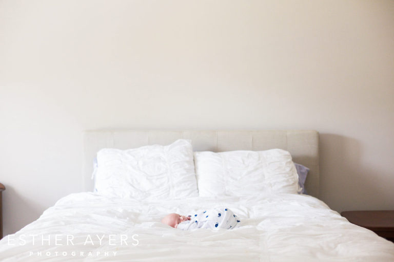 Newborn Baby Boy on Bed in Master Bedroom