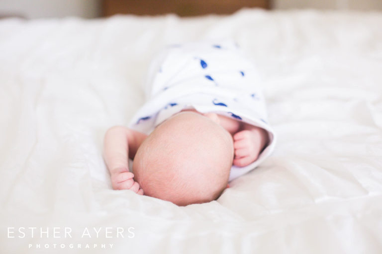Newborn Baby Boy on Bed in Master Bedroom