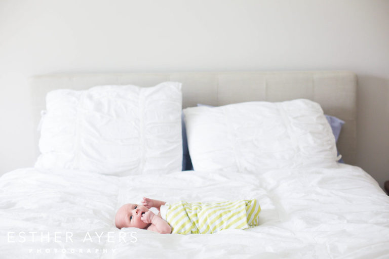 Swaddled Newborn Baby Boy in green and white wrap