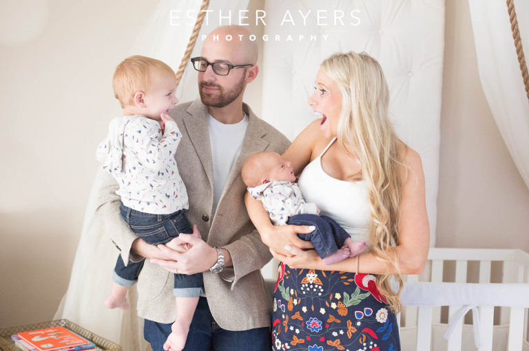 Newborn Baby Boy with Mom and Dad and big brother in Nursery