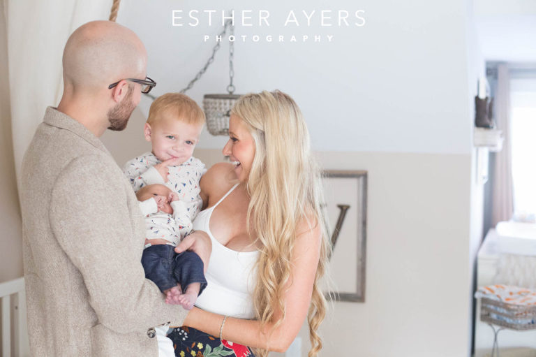 Newborn Baby Boy with Mom and Dad and big brother in Nursery