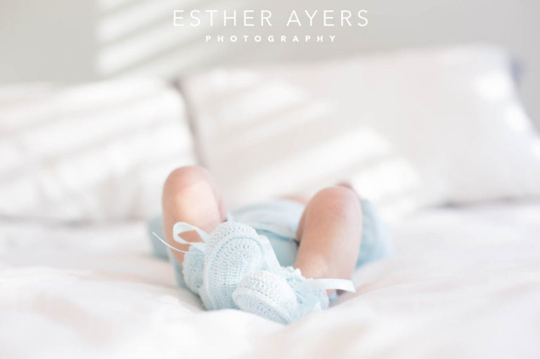Newborn Baby Boy on Bed in Nursery