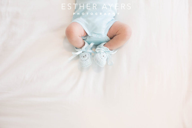 Newborn Baby Boy on Bed in Nursery