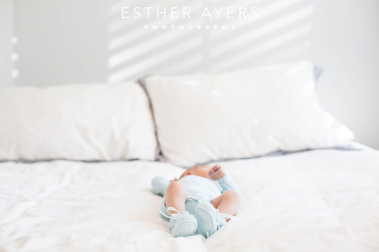 Newborn Baby Boy on Bed in Nursery