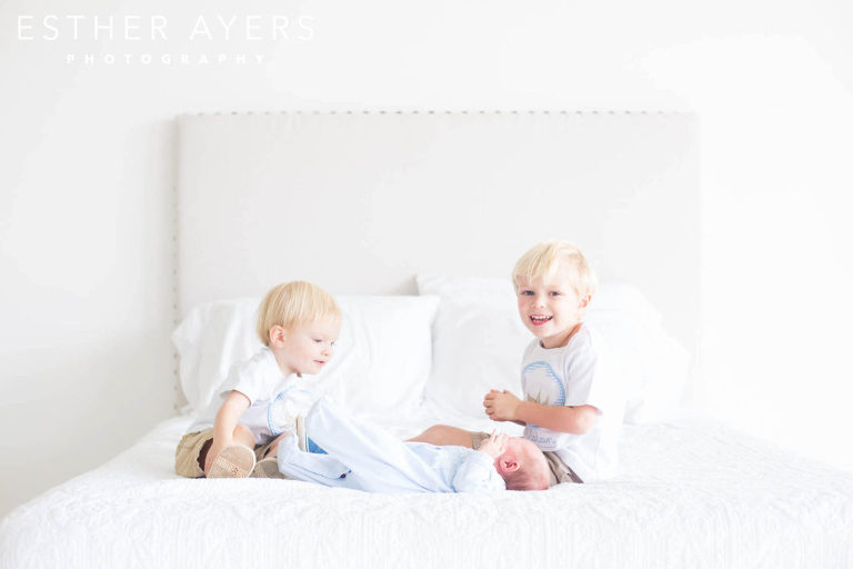 Brothers and Baby Boy on Bed