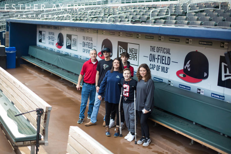 Dream on 3 kid with family in baseball dugout at Atlanta Braves SunTrust Park