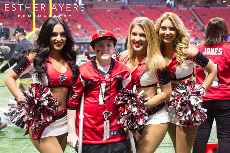 Dream on 3 Honorary Captain at Atlanta Falcons football game with cheerleaders