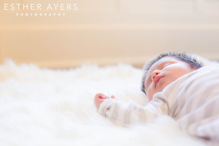 newborn baby boy on faux fur rug